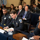 Aquilino Gonell, sergeant of the U.S. Capitol Police, Michael Fanone, officer for the Metropolitan Police Department, and Harry Dunn (far right), private first class of the U.S. Capitol Police, listen while Daniel Hodges, officer for the Metropolitan Police Department, testifies during a hearing of the House select committee investigating the January 6 attack on the U.S. Capitol on July 27, 2021.